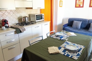 Apartamento, sacada | Cozinha privada