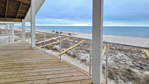 A wooden deck with a railing overlooking a beach. - Sugarcane: New Construction, Private Pool, 6 Bedrooms (Mexico Beach)