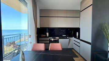 Comfort Apartment, Balcony, Sea View | Private kitchen | Full-sized fridge, oven, stovetop, electric kettle
