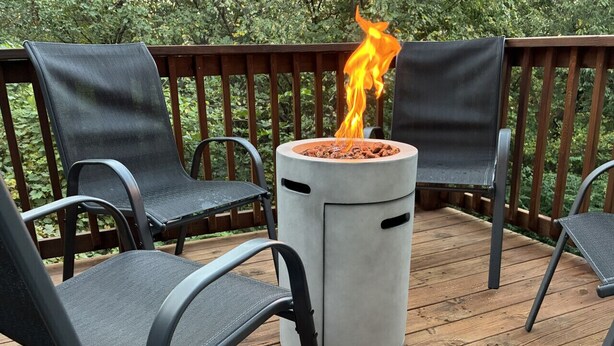 A deck with a fire pit and four chairs. - 2 Kings, Workspace, Garage 3bdrm - Pastore`s Place (Manhattan)