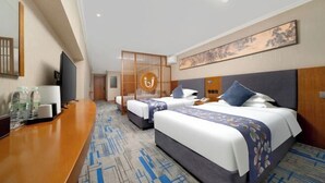A hotel room with two beds, a desk, a television, and a decorative screen. - Diyu Mansion Hotel (Harbin Central Street) (Harbin)