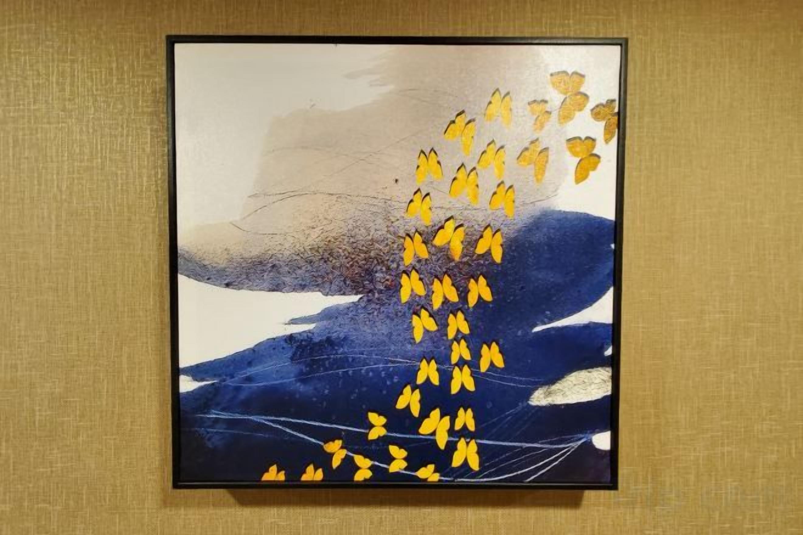 A framed abstract painting with a central vertical element and a textured background.