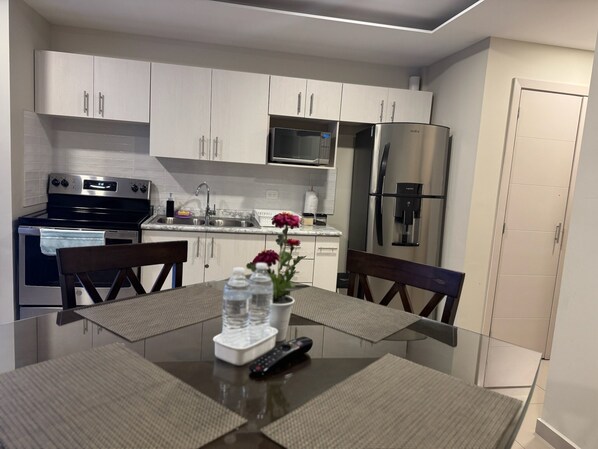 Microwave, oven, coffee/tea maker, cookware/dishes/utensils