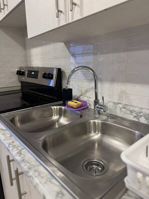 Microwave, oven, coffee/tea maker, cookware/dishes/utensils