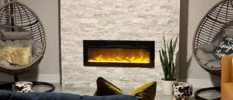 Smart TV, fireplace, books