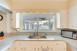 Fridge, stovetop, dishwasher, coffee/tea maker