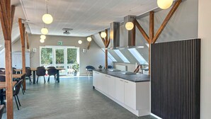 A modern kitchen with white cabinets, a central island, and pendant lighting. - Beautiful home in Brørup with WiFi (Brørup)