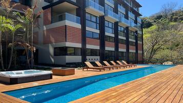 Outdoor pool, pool umbrellas, sun loungers