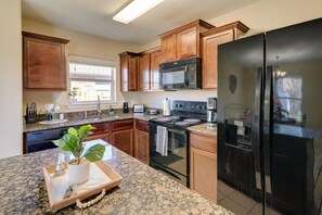 Fridge, microwave, stovetop, dishwasher - Suburban Home in Magnolia w/ Fenced Yard (Magnolia)