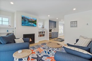 Maison, plusieurs lits, cheminée, vue jardin (BEACH AVENUE 23) | Coin séjour