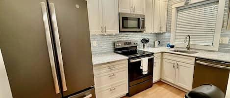 Townhome, Multiple Beds, Patio, Garden View | Private kitchen | Coffee/tea maker