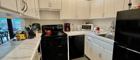 House, Multiple Beds, Fireplace, Garden View | Private kitchen | Coffee/tea maker