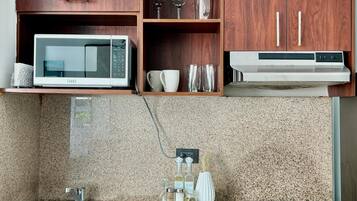 Microwave, coffee/tea maker, cookware/dishes/utensils