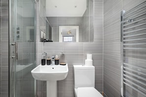 Shower, hair dryer, towels, soap
