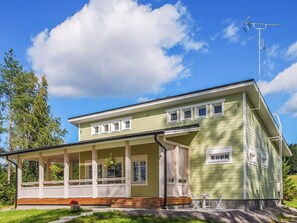 A two-story house with a porch, a satellite dish, and a clear sky. - Villa onnela by Interhome (Hämeenkyrö)