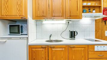 Fridge, microwave, cookware/dishes/utensils