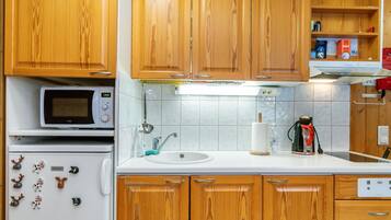 Fridge, microwave, cookware/dishes/utensils