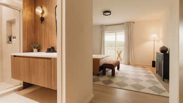 A modern bathroom with a wooden vanity, a shower area, and a small plant.