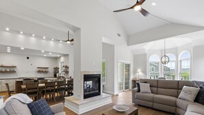 A spacious living room with a fireplace, a sofa, and a coffee table. - 7 Bedroom, 4 Full Baths, and Two Blocks to Beach (Cape May)