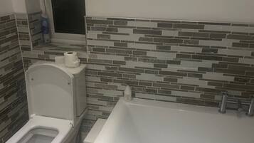 Separate tub and shower, deep soaking tub, towels