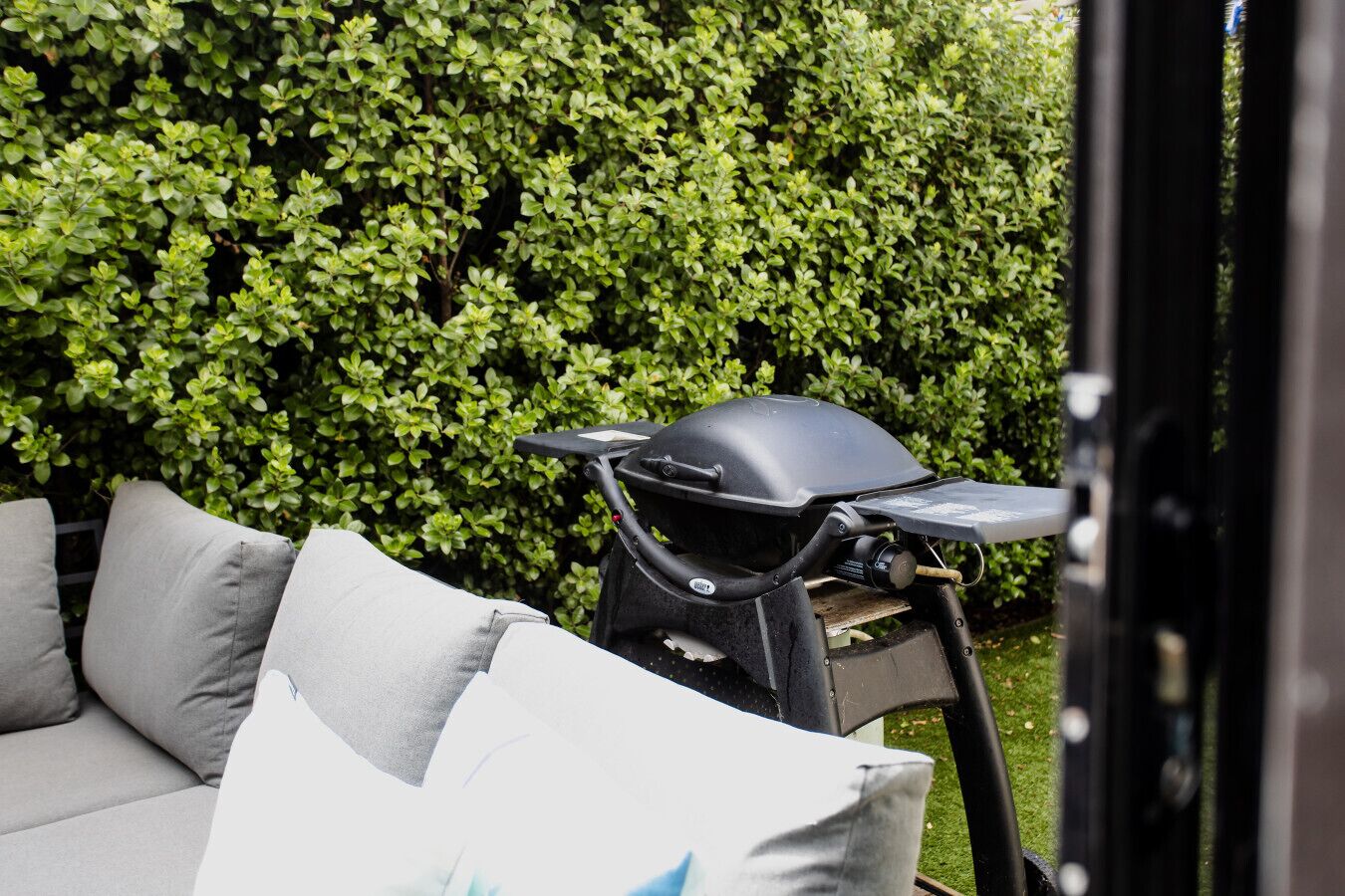 Private outdoor BBQ area with seating, perfect for relaxed meals