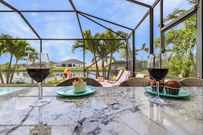 Outdoor dining - Heated Pool, Gulf Access, Dock, Outdoor Kitchen - Gulf Coast Haven - Roelens (Cape Coral)