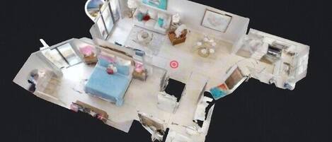 Ein 3D-Grundriss eines Hotelzimmers mit einem Bett, einem Schreibtisch, einem Stuhl, einem kleinen Tisch und einem Fenster.