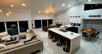 Escape to Paradise at This Waterfront Luxury Home!