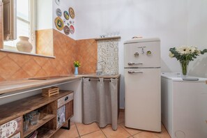 Fridge, stovetop, toaster, cookware/dishes/utensils