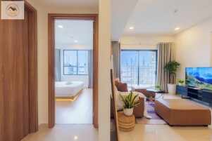 Panoramic Room, Balcony, City View | Living area | 42-inch flat-screen TV with cable channels