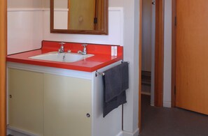 Shower, hair dryer, towels, toilet paper