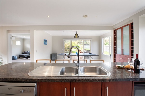 Open-plan kitchen overlooking dining and living areas for easy entertaining