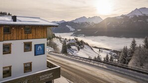 A building with a sign for 'Alps Resorts' and 'Bergerstort Taurnblick'.