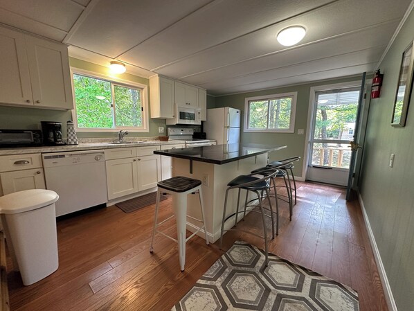 Microwave, oven, coffee/tea maker, cookware/dishes/utensils