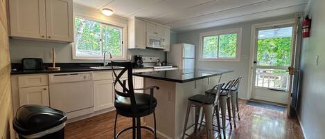 Microwave, oven, coffee/tea maker, cookware/dishes/utensils