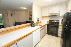 Fridge, microwave, stovetop, coffee/tea maker