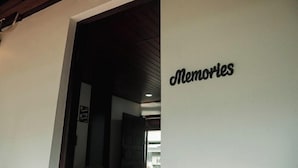 An interior hallway with a sign reading "Memories" on the wall.