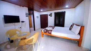 Comfort Room, 1 Queen Bed, Private Bathroom, Garden Area | In-room safe, desk, laptop workspace, blackout curtains
