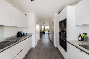 Fridge, coffee/tea maker, cookware/dishes/utensils