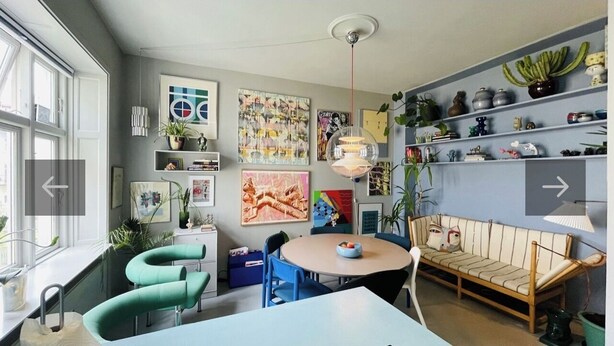 A modern kitchen with a dining area, featuring a round table, chairs, and a sofa. - Spacious apartment for a family of 4 with easy access to metro, grocery, parks (København)