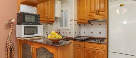 Fridge, microwave, cookware/dishes/utensils