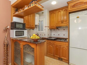 Fridge, microwave, cookware/dishes/utensils