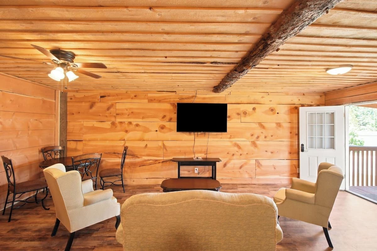 Upstairs Suite | Living room | 32-inch Smart TV with cable channels, table football