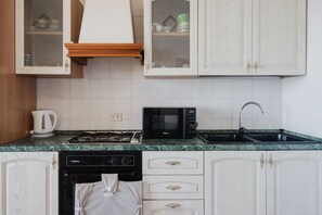 Fridge, oven, stovetop, dining tables