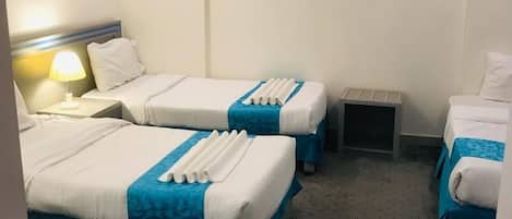 Standard Quadruple Room | Egyptian cotton sheets, premium bedding, blackout drapes, free WiFi