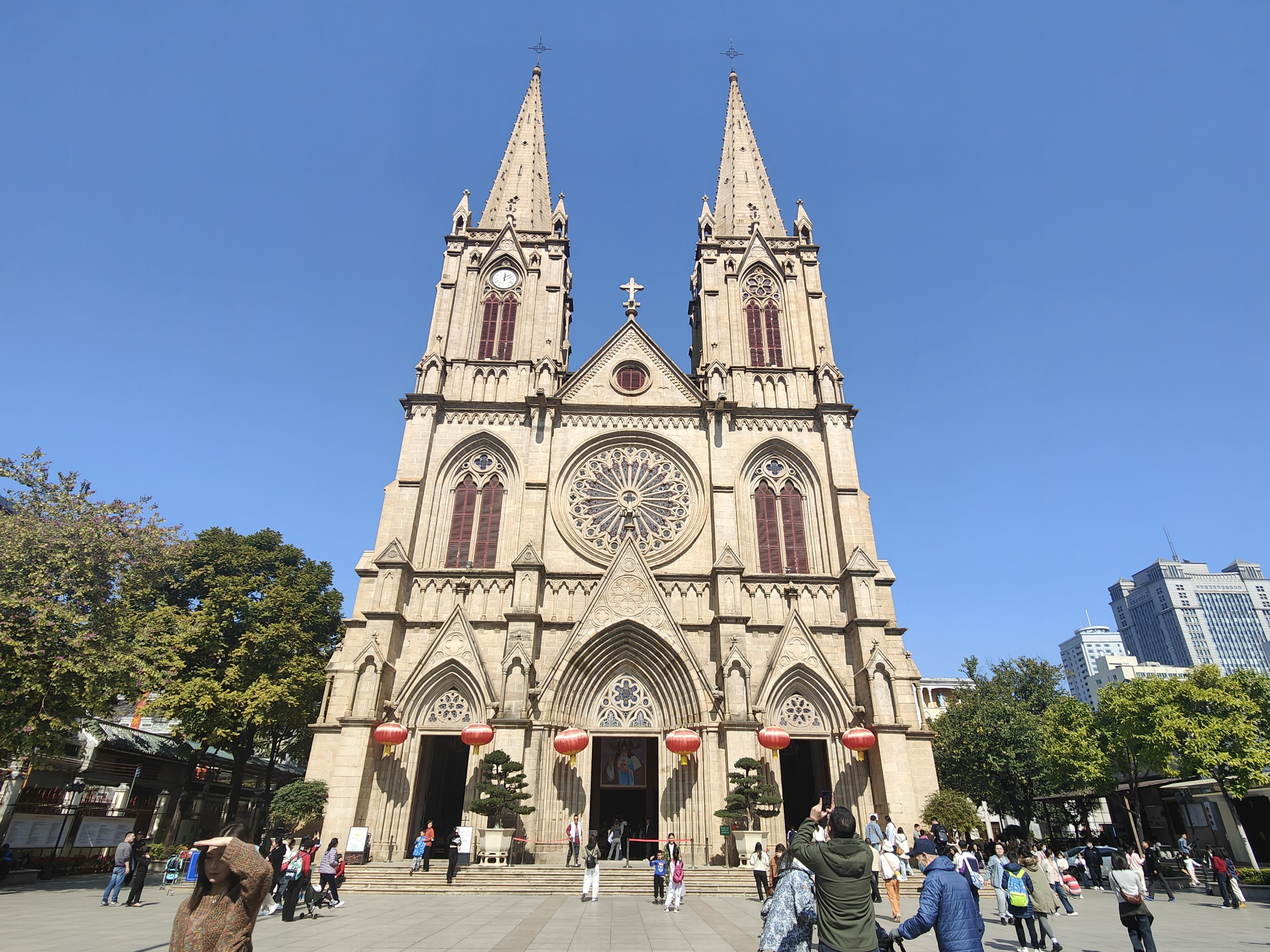 A large cathedral with two towers and a central rose window.