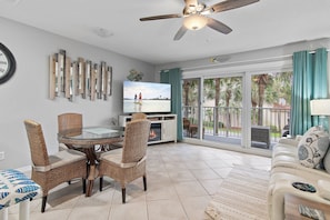 TV, fireplace, books - Beach View Balcony • Hot Tub + 2 Pools • Steps to Private Beach (Miramar Beach)