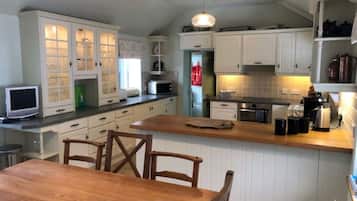 Microwave, oven, dishwasher, dining tables