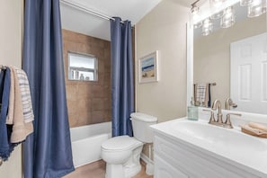 Shower, hair dryer, towels, shampoo