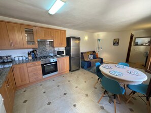 Superior Apartment, Courtyard View | Living area | Printers